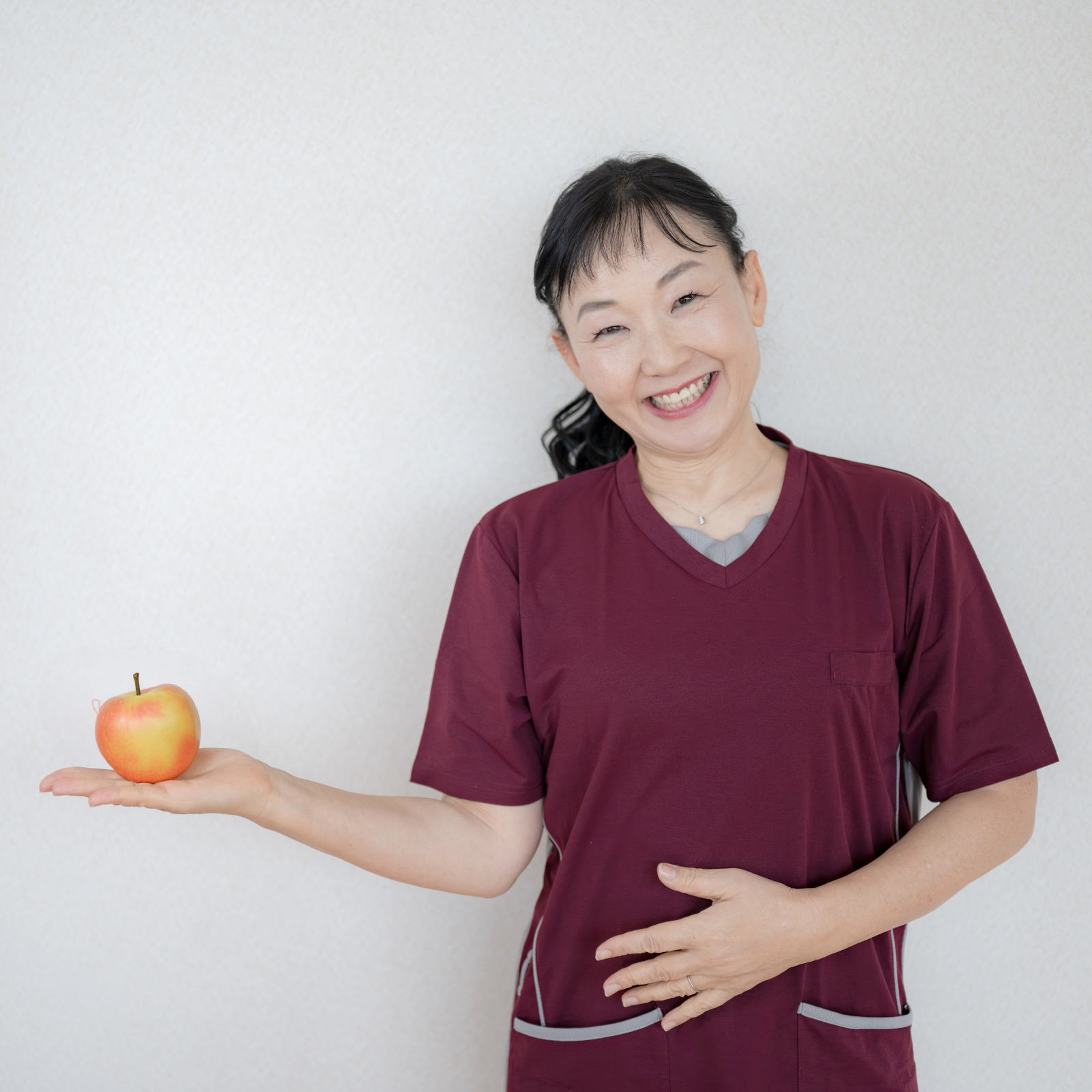 woman holding an apple