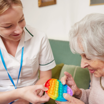 two women with popping object
