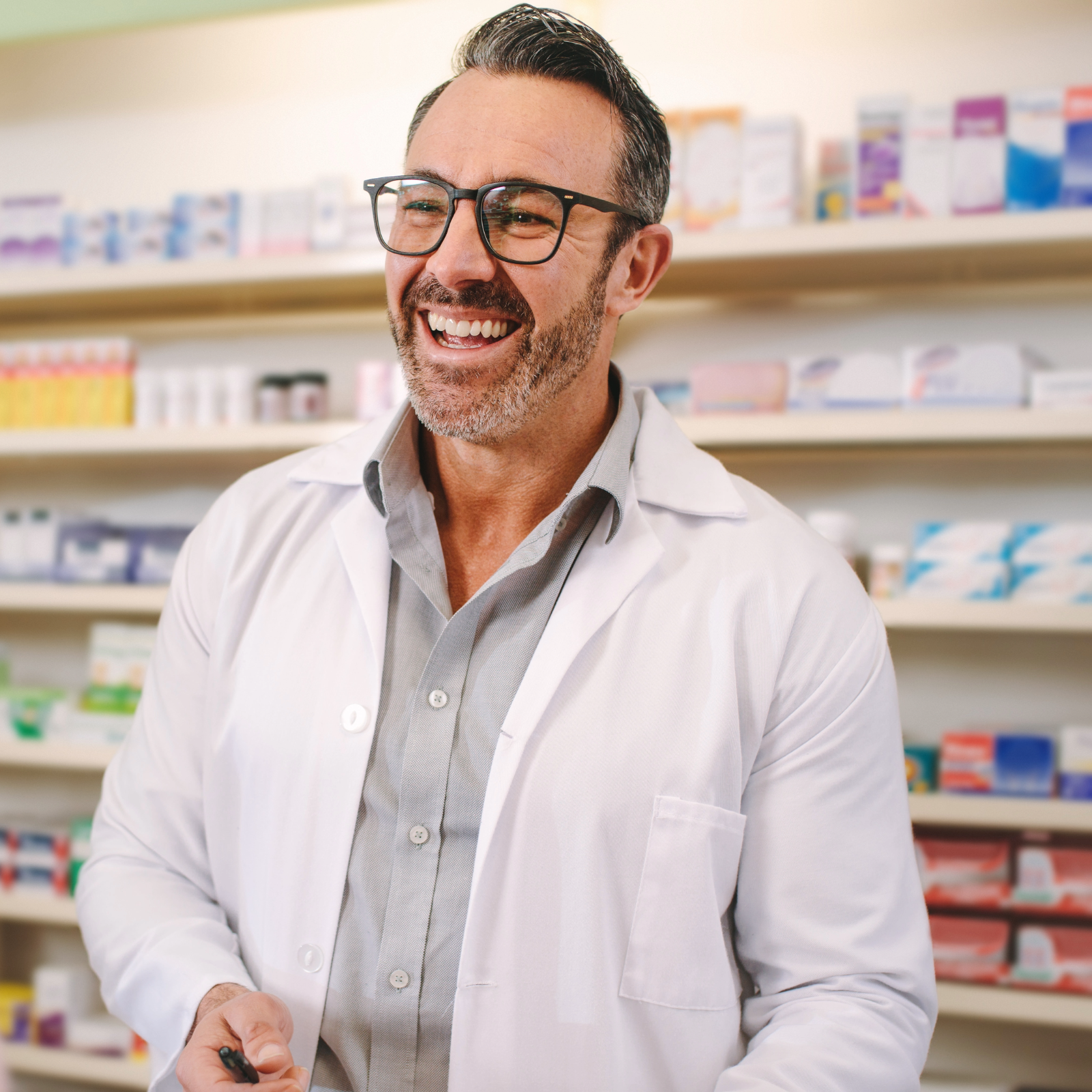 community pharmacist laughing with patient