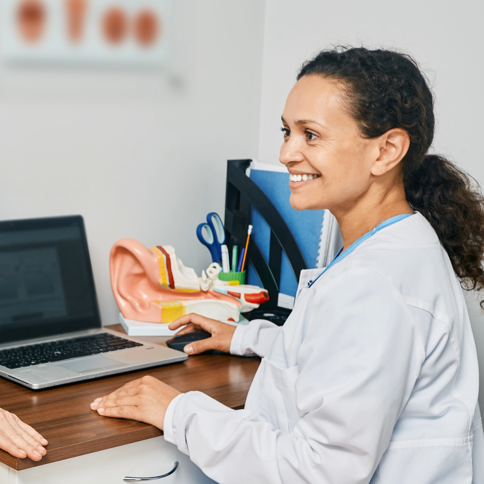 audiologist with a patient 